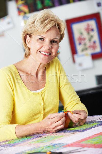 Stock photo: Portrait Of Woman Sewing Quilt