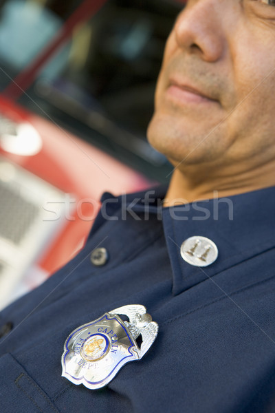 Portrait of a firefighter by a fire engine Stock photo © monkey_business