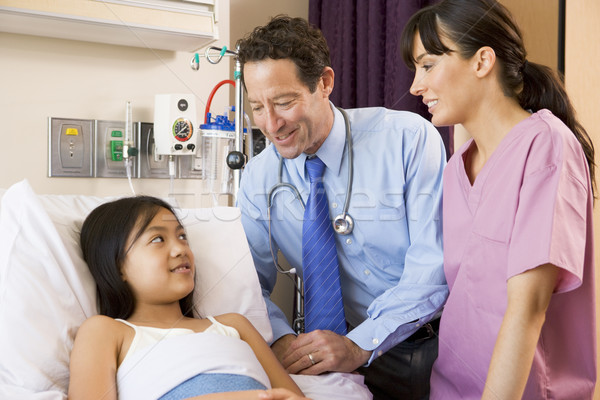 Doctor And Nurse Talking To Young Girl Stock photo © monkey_business