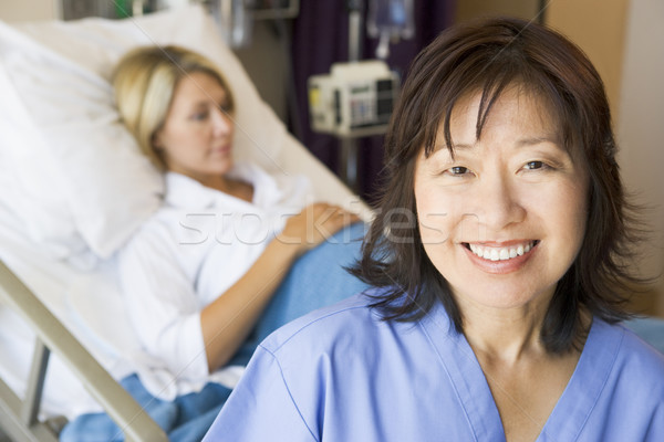 Doctor Standing In Patients Room,Smiling Stock photo © monkey_business