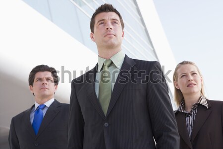 Сток-фото: три · деловые · люди · Постоянный · улице · здании · улыбаясь