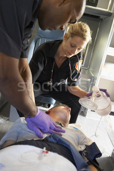 Paramedics performing CPR on patient in ambulance Stock photo © monkey_business