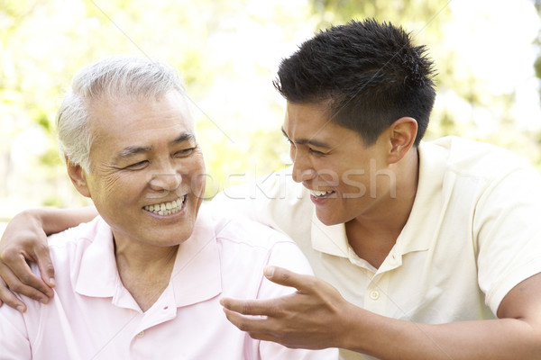 Father With Adult Son In Park Stock photo © monkey_business