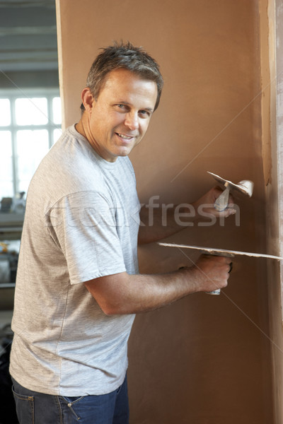 Plasterer Working On Interior Wall Stock photo © monkey_business