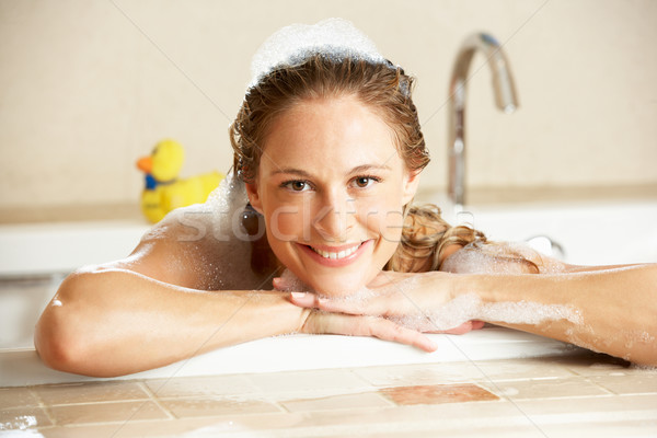 Woman Relaxing In Bubble Filled Bath Stock photo © monkey_business