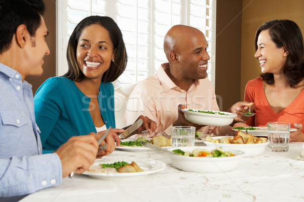 Group Of Friends Enjoying Meal At Home Stock photo © monkey_business