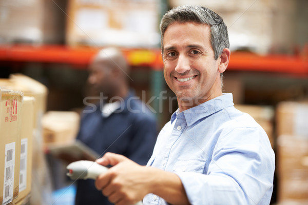 Worker Scanning Package In Warehouse Stock photo © monkey_business