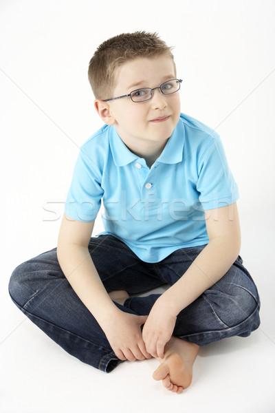 Fiatal srác ül stúdió gyerekek portré fiú Stock fotó © monkey_business