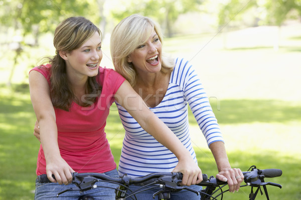 Mother And Daughter Cycling Through A Park Stock photo © monkey_business