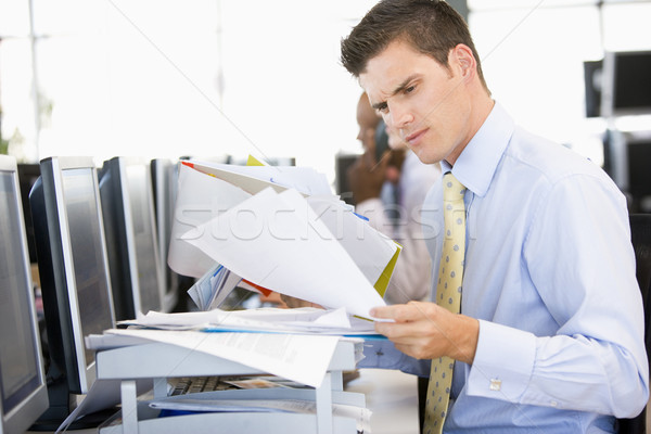 Stock Trader Looking Though Paperwork Stock photo © monkey_business