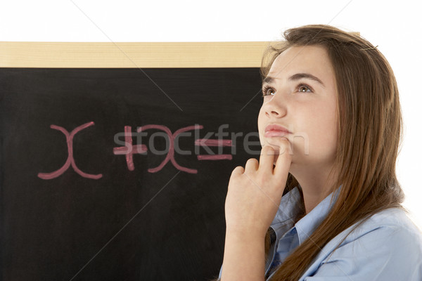 Mirando femenino estudiante pie pizarra Foto stock © monkey_business