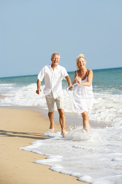 Genießen Strandurlaub Frau Strand Paar Stock foto © monkey_business