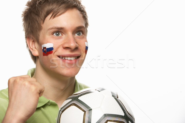 Stock photo: Young Male Football Fan With Slovakian Flag Painted On Face