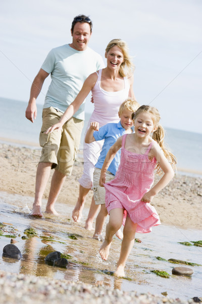 Сток-фото: семьи · работает · пляж · улыбаясь · женщину · лет