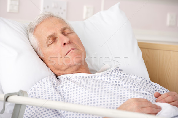 Senior man asleep in hospital bed Stock photo © monkey_business