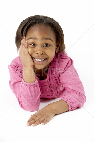 Stock photo: Young Girl Lying On Stomach In Studio