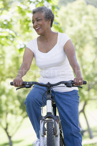 Kıdemli kadın devir egzersiz bisiklet kadın Stok fotoğraf © monkey_business
