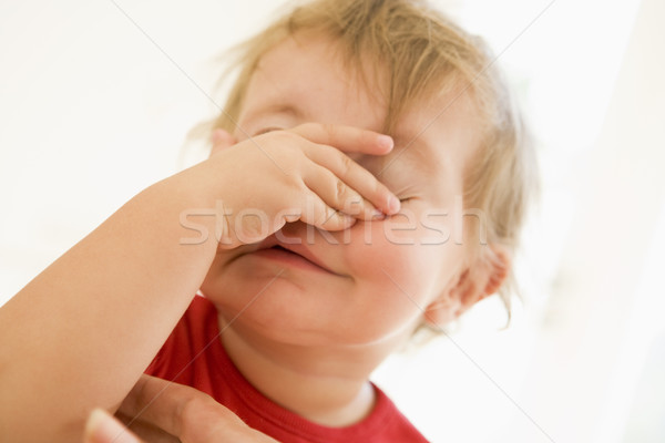 Baby binnenshuis hand gezicht kind grappig Stockfoto © monkey_business