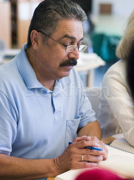 Mature male student studying in library Stock photo © monkey_business
