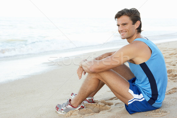 Genç uygunluk giyim egzersiz plaj Stok fotoğraf © monkey_business