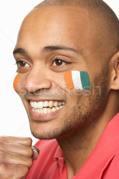 Young Male Sports Fan With Ivory Coast Flag Painted On Face Stock photo © monkey_business