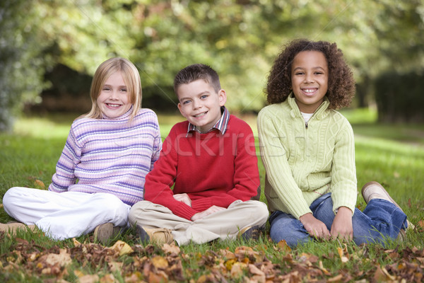Stock photo: Group of children sitting in garden