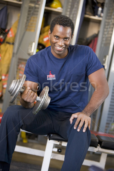 Portrait of a firefighter in the fire station locker room Stock photo © monkey_business