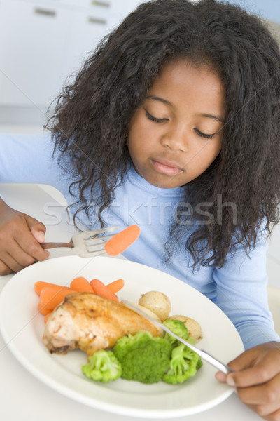 Fiatal lány konyha eszik tyúk zöldségek lány Stock fotó © monkey_business