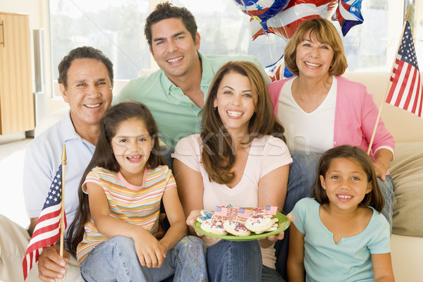 Family in living room on fourth of July with flags and cookies s Stock photo © monkey_business