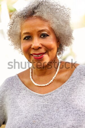 Fashionable Woman Wearing Knitwear And Cap In Studio Stock photo © monkey_business