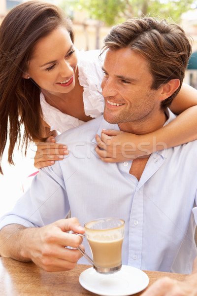 Young Couple Enjoying Coffee And Cake In Caf Stock photo © monkey_business
