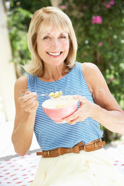 Senior Woman Enjoying Bowl Of Breakfast Cereal Stock photo © monkey_business