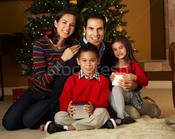 Stock photo: Family In Front Of Christmas Tree
