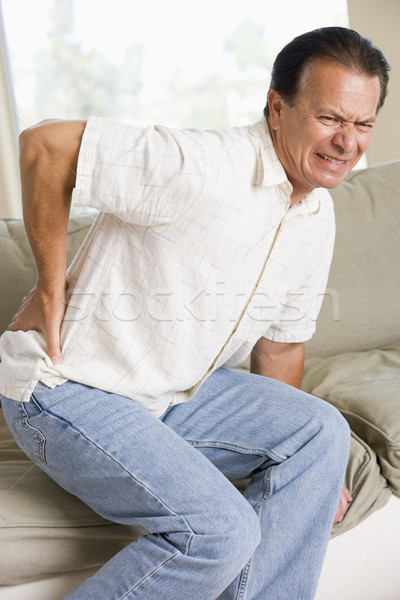 Uomo mal di schiena indietro dolore colore seduta Foto d'archivio © monkey_business