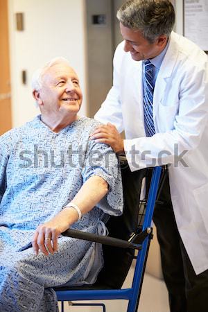 Nurse Pushing Man In Wheelchair Stock photo © monkey_business