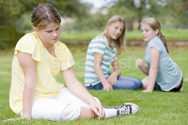 Deux jeunes filles autre jeune fille [[stock_photo]] © monkey_business