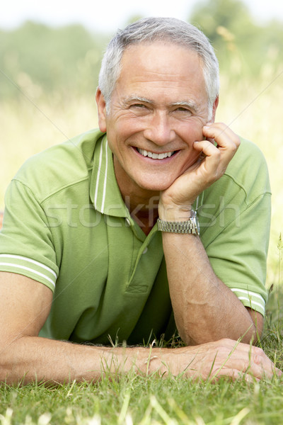 Stock photo: Portrait of mature man relaxing in countryside