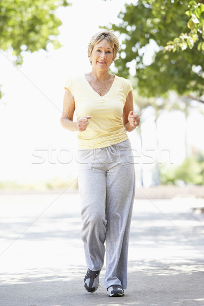 Photo stock: Supérieurs · femme · jogging · parc · heureux · courir