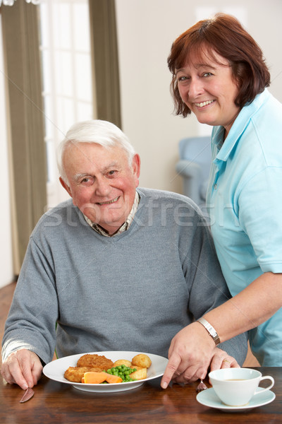 Senior Man Being Served Meal By Carer Stock photo © monkey_business