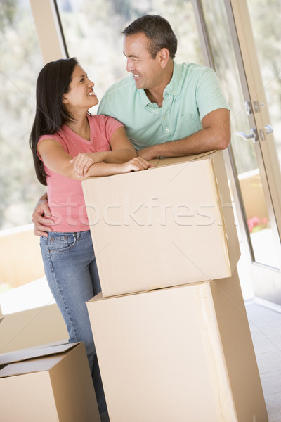 Сток-фото: пару · коробки · новый · дом · улыбаясь · женщину · дома