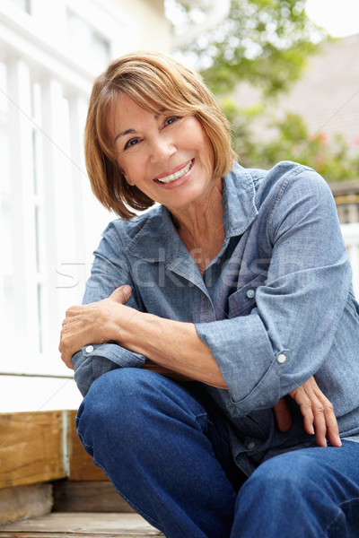 Mid age woman relaxing in garden Stock photo © monkey_business