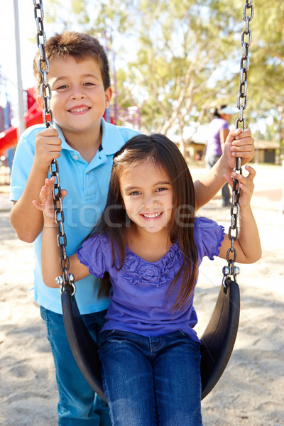 мальчика девушки играет Swing парка ребенка Сток-фото © monkey_business