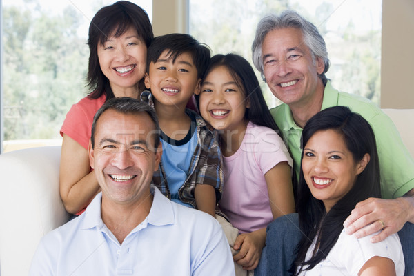 Extended family in living room smiling Stock photo © monkey_business
