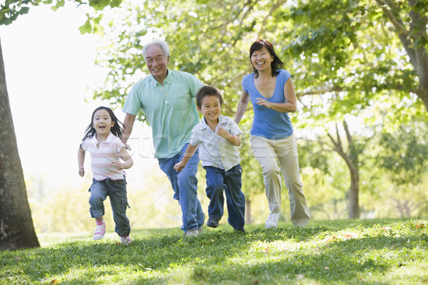 Grands-parents courir petits enfants famille homme heureux [[stock_photo]] © monkey_business