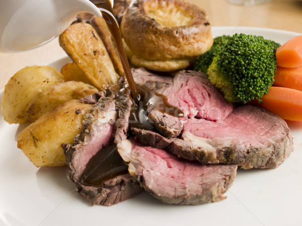 Gravy being Poured on a plate of Roast Beef and Yorkshire Puddin Stock photo © monkey_business