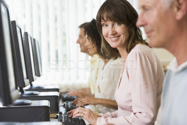 Stock photo: Adult students in a computer lab
