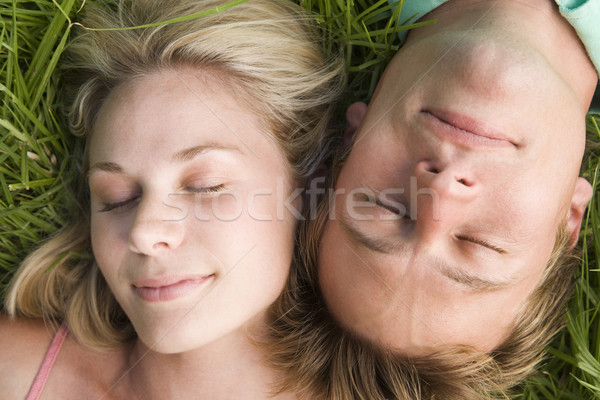 Couple lying in grass sleeping Stock photo © monkey_business