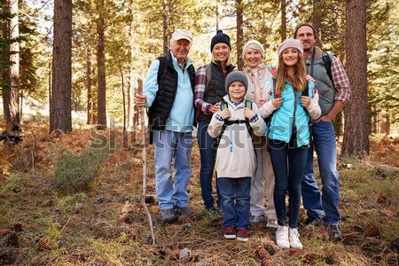 Family Group Outdoors In Autumn Landscape With Parents Giving Ch Stock photo © monkey_business
