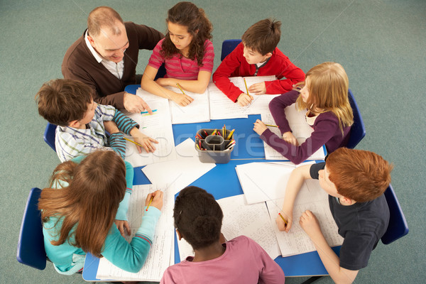 Overhead View Of Schoolchildren Working Together At Desk With Te Stock photo © monkey_business