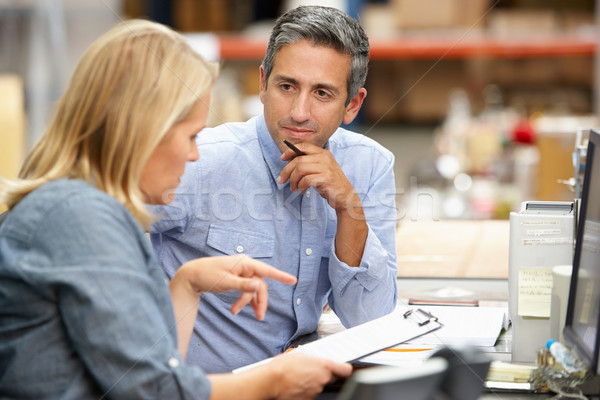 Stock photo: Business Colleagues Working At Desk In Warehouse